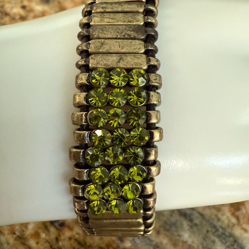Marilyn Schiff Gold Bracelet with Green stone Accents
